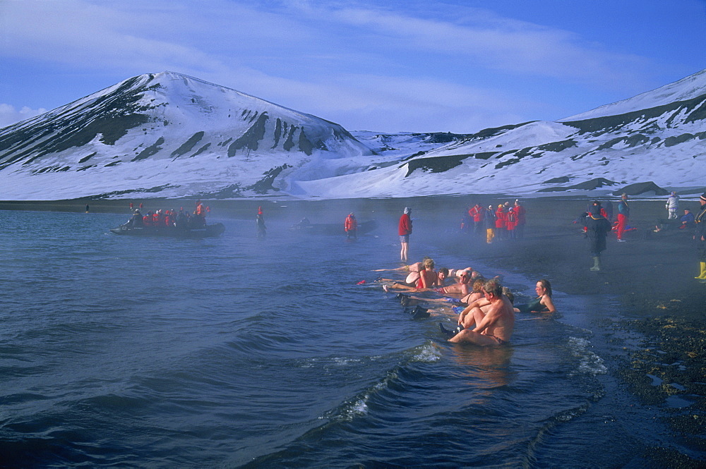 Tourists bathing in hot tub in dormant volcanic crater, Deception Island, Antarctica, Polar Regions