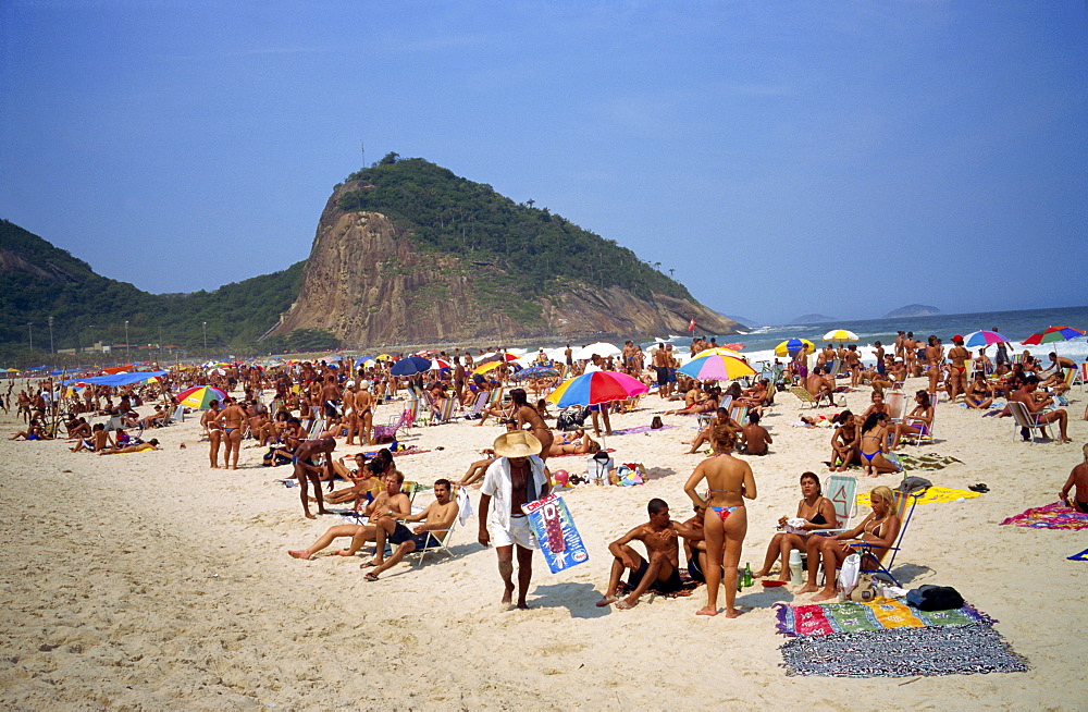 Crowds of people sunbathing on Copacabana Beach in Rio de Janeiro, Brazil, South America