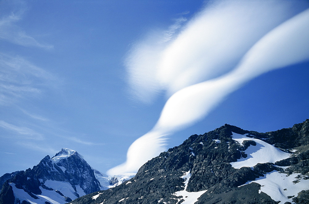 Lenticular clouds over landscape of mountains in South Georgia, Atlantic Ocean, Polar Regions