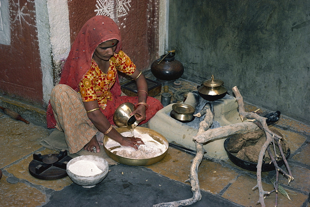 Woman in her kitchen, Jaisalmer, Rajasthan state, India, Asia