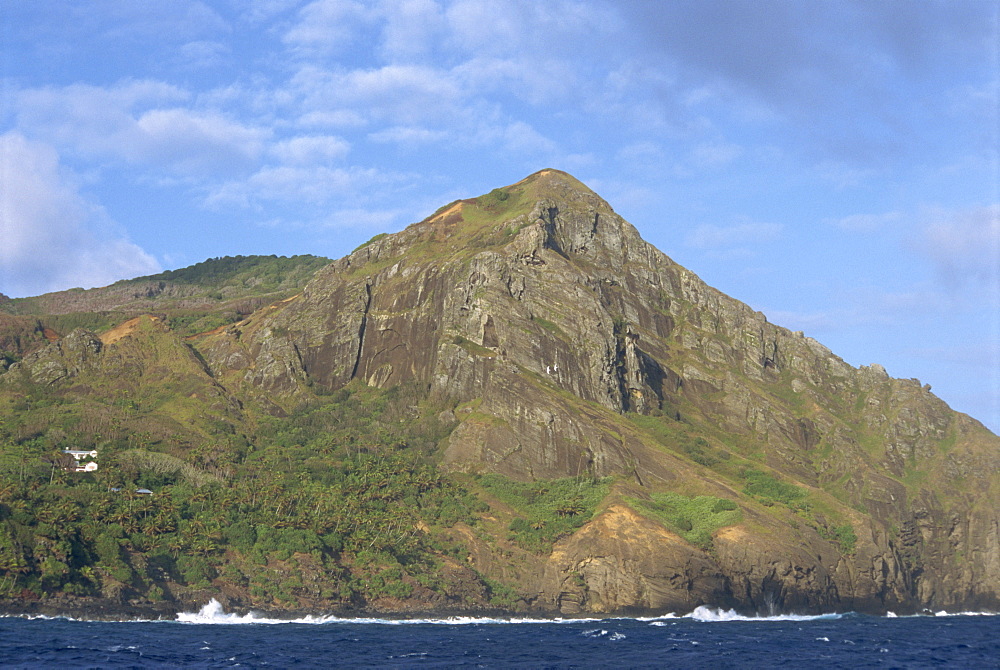 Landscape of coastline and rocky hills of Pitcairn Island, Pacific