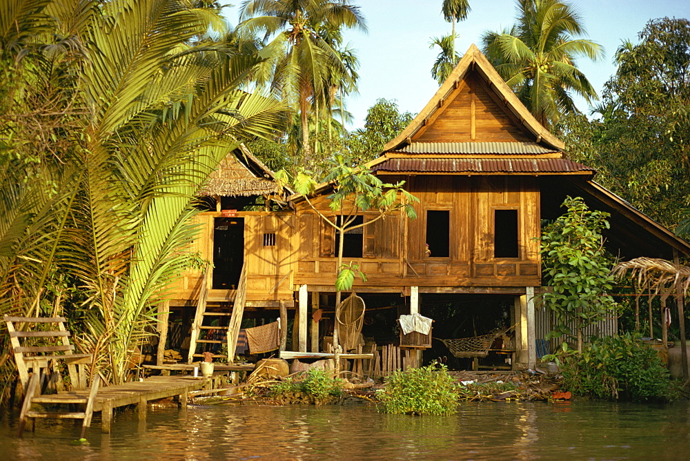 A traditional Thai house on stilts above the river in Bangkok, Thailand, Southeast Asia, Asia