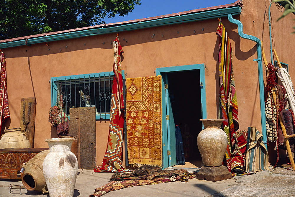 Assorted ethnic items on display outside shop, Guadalupe Street, Sante Fe, New Mexico, United States of America, North America