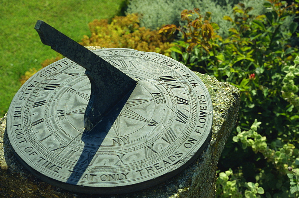 Sundial on plate of slate inscribed Noiseless falls the foot of time that only treads on flowers 1905, Little Hall, Lavenham, Suffolk, England, United Kingdom, Europe