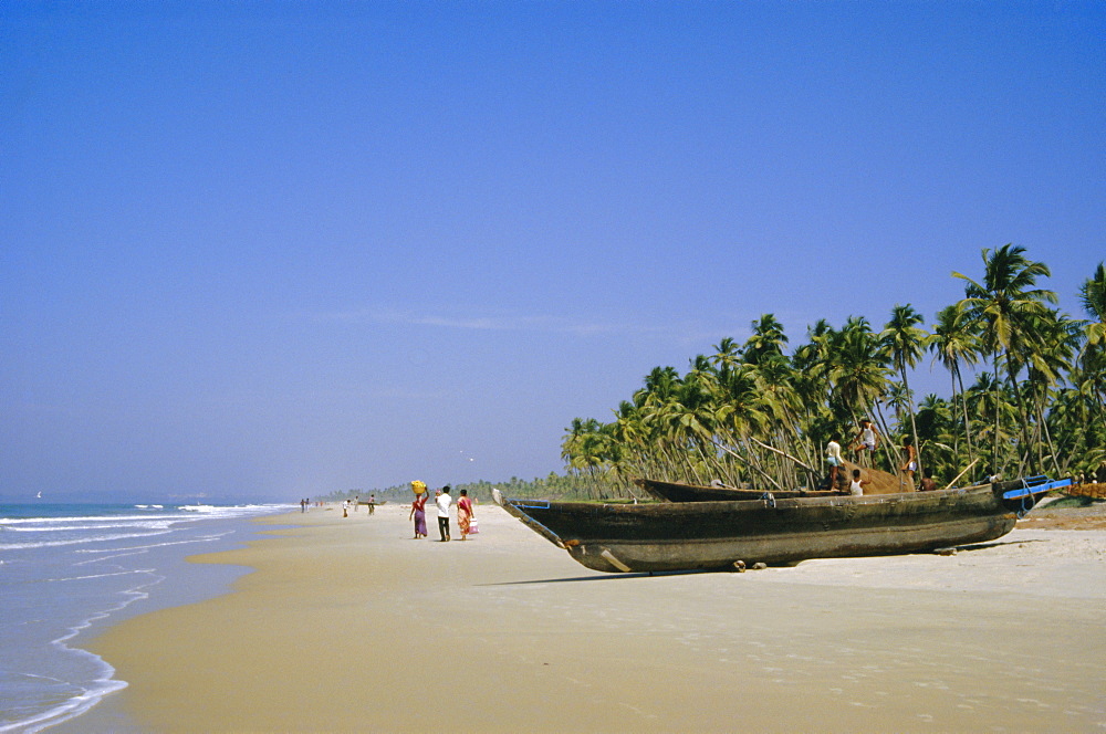 Palm trees and fishing boats, Colva Beach, Goa, India