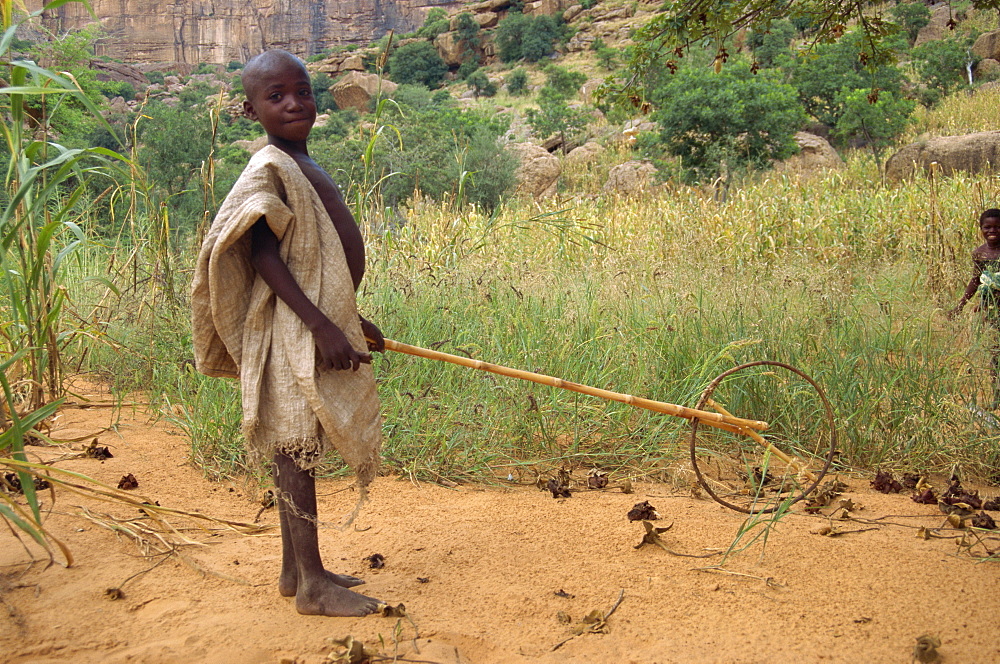 Dogon boy with home made toy, Mali, Africa