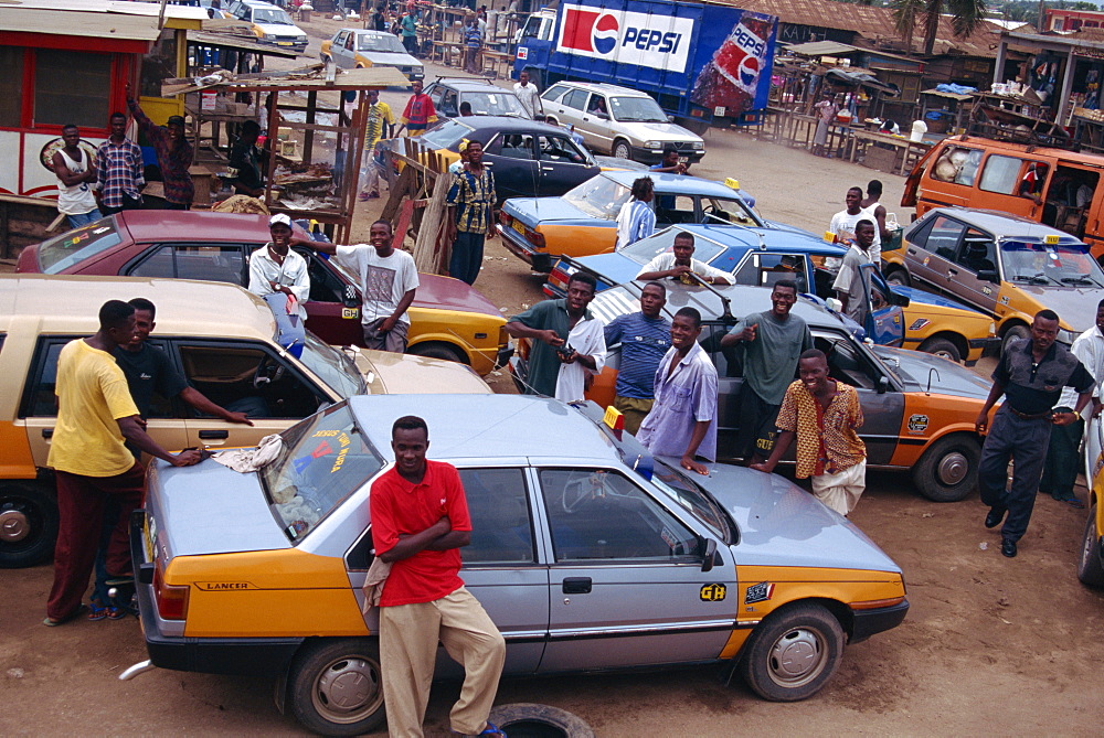 Taxis and drivers on street, Kasoa, Ghana, West Africa, Africa