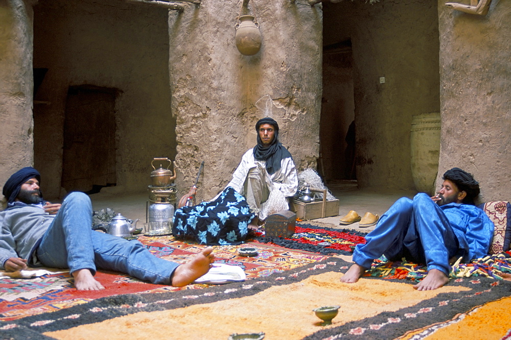 Three men chilling out in the Museum at Oulad Driss, Draa Valley, Morocco, North Africa, Africa