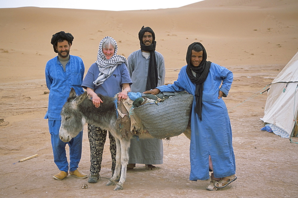 End of desert trek photo, tourist with guide, cook, camel man and donkey, Chigaga, Draa Valley, Morocco, North Africa, Africa