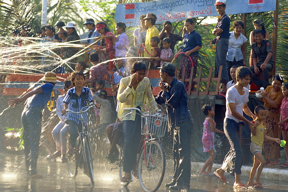 Crowds being sprayed with water during the Water Festival, Mandalay, Myanmar (Burma), Asia