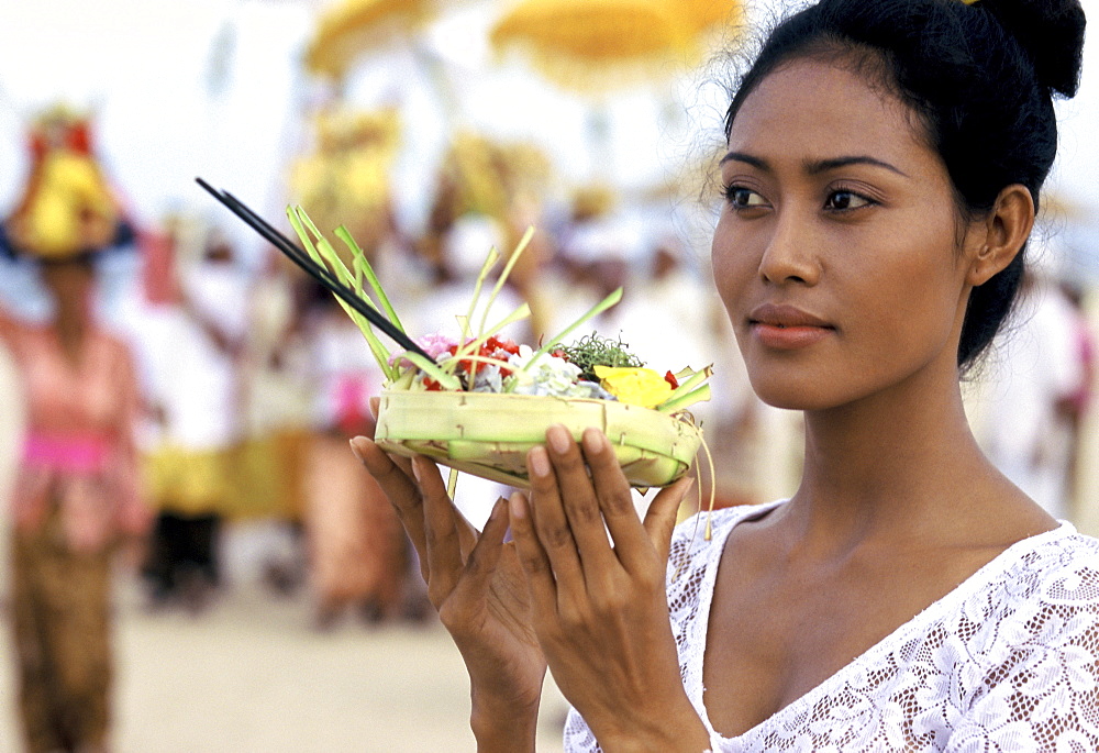 Girl with offerings at a reliqious ceremony in Bali, Indonesia, Southeast Asia, Asia