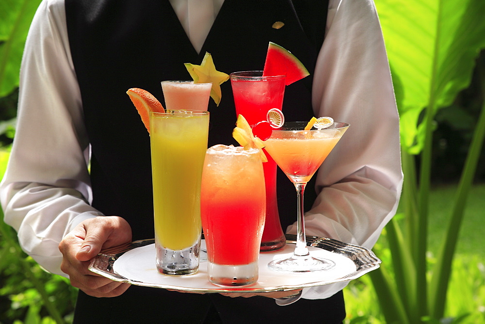 Waiter with tray of cocktails 