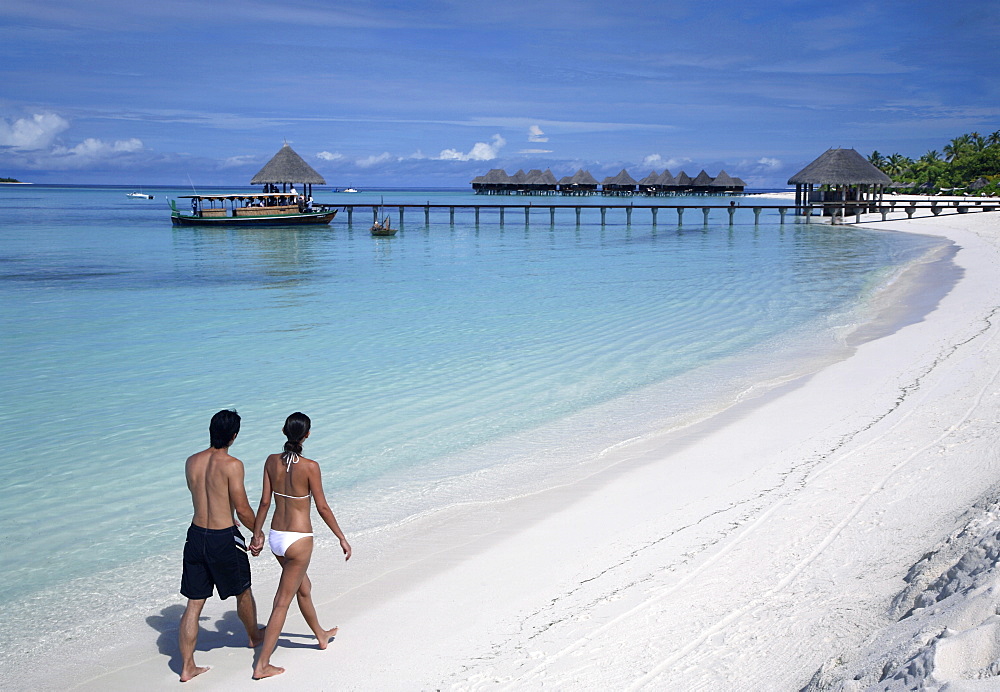 Couple on the beach at Cocopalm, Maldives, Indian Ocean, Asia