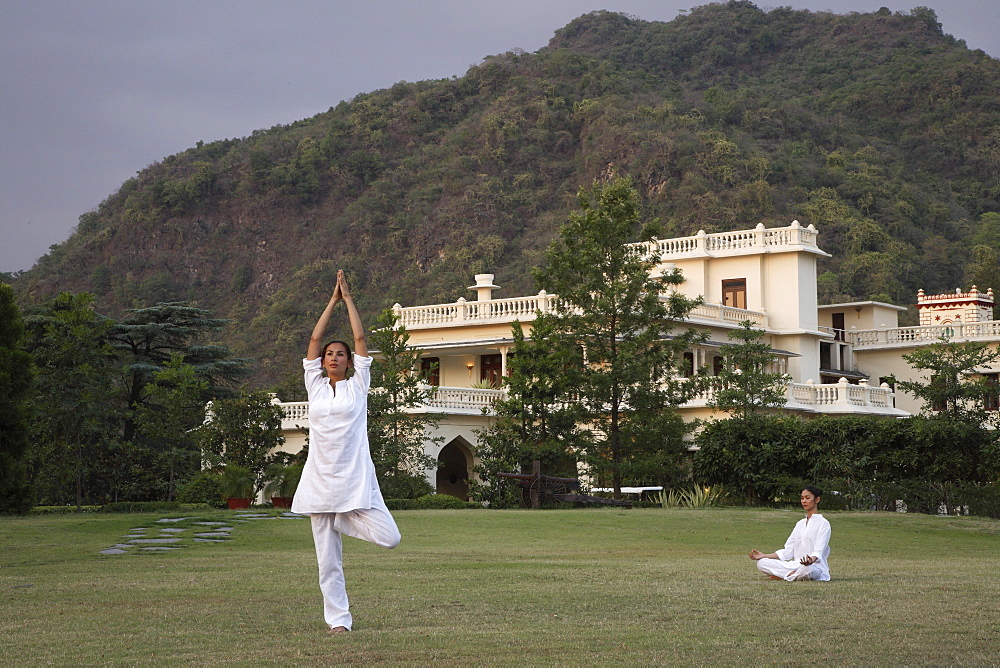 Yoga on the lawn in front of palace at Ananda in the Himalayas, India, Asia