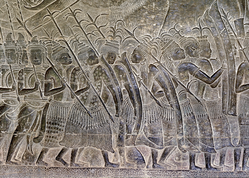 Early 12th century reliefs with later additions, in the gallery showing the Thais marching as allies of the Khmer army, Angkor Wat, Angkor, UNESCO World Heritage Site, Cambodia, Indochina, Southeast Asia, Asia