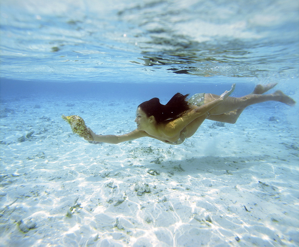 Girl snorkeling in The Maldives, Indian Ocean, Asia