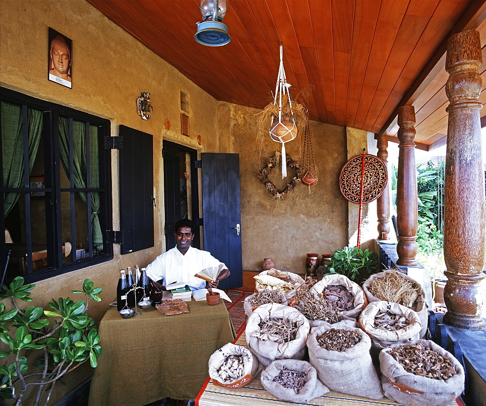 Ayurvedic doctor in displaying herbal medicines, Sri Lanka, Asia