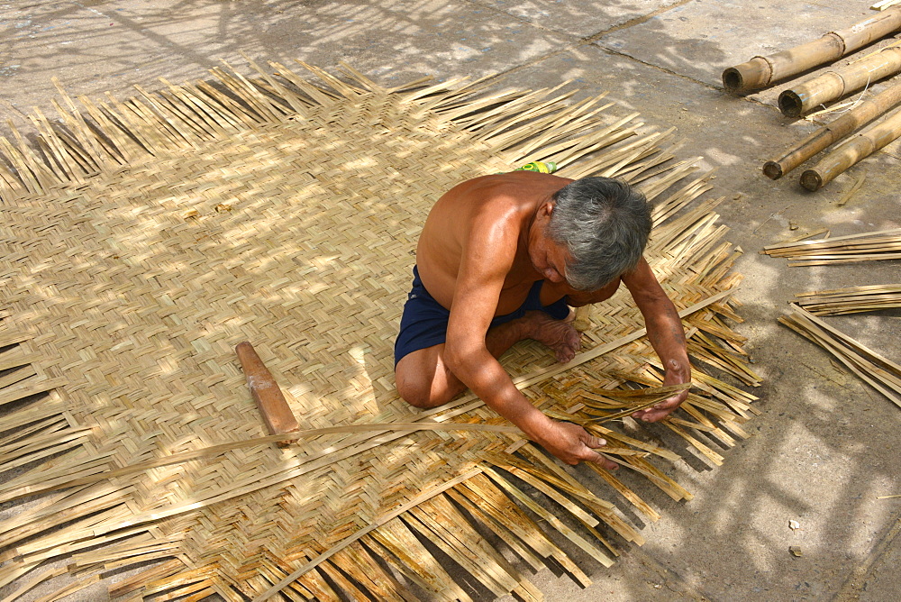 Weaving a basket tug boat, Phan Thiet, Vietnam, Indochina, Southeast Asia, Asia