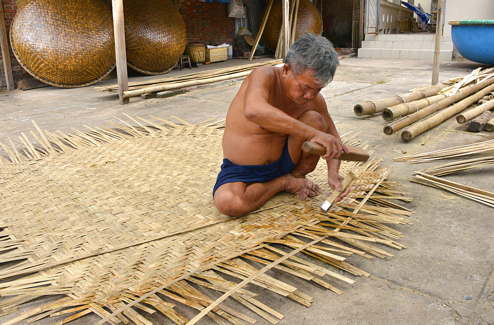 Weaving a basket tug boat, Phan Thiet, Vietnam, Indochina, Southeast Asia, Asia