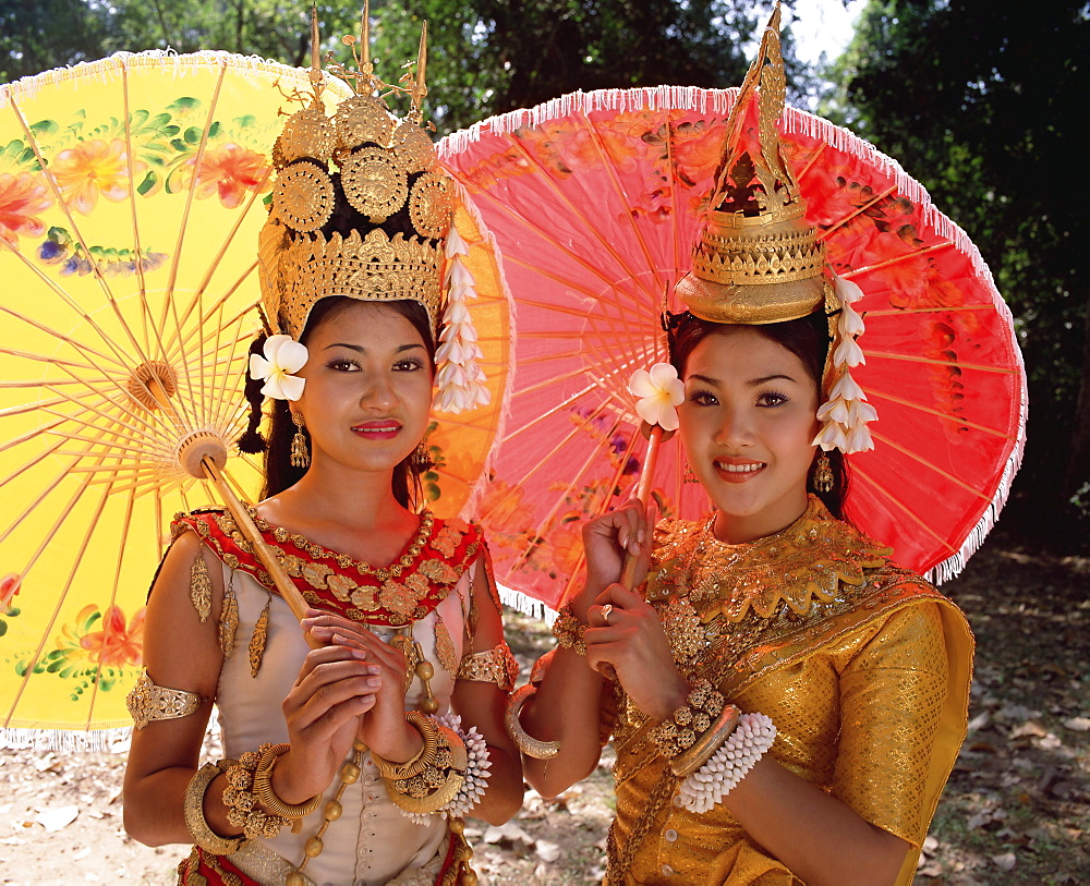 Head and shoulders portrait of two traditional Cambodian apsara dancers, smiling and looking at the camera, at Angkor, Siem Reap Province, Cambodia, Indochina, Southeast Asia, Asia