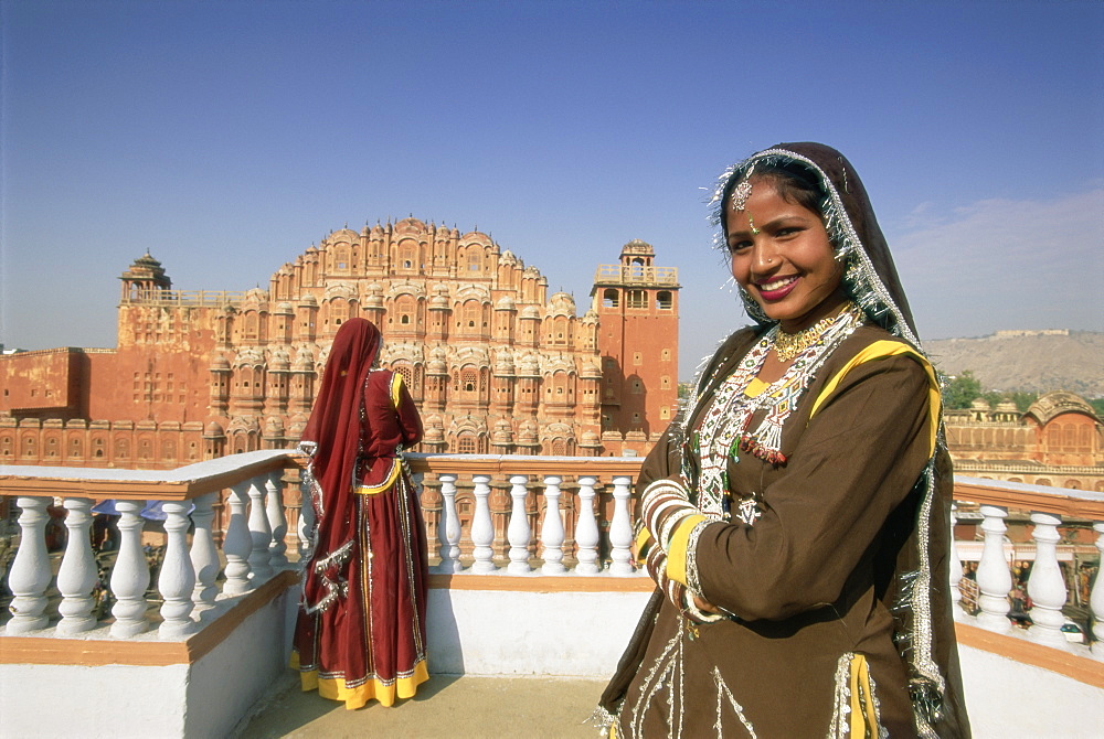 Women in saris in front of the facade of the Palace of the Winds (Hawa Mahal), Jaipur, Rajasthan state, India, Asia