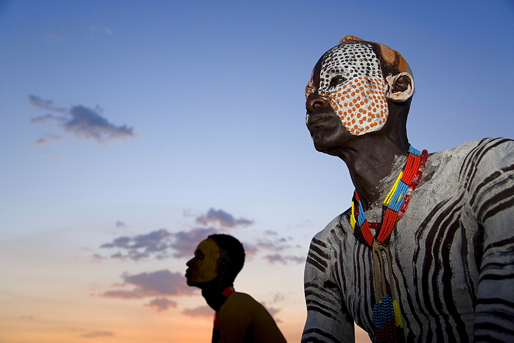 Portrait of a Karo tribesman with facial decoration in chalk imitating the spotted plumage of the guinea fowl, Lower Omo Valley, Ethiopia, Africa