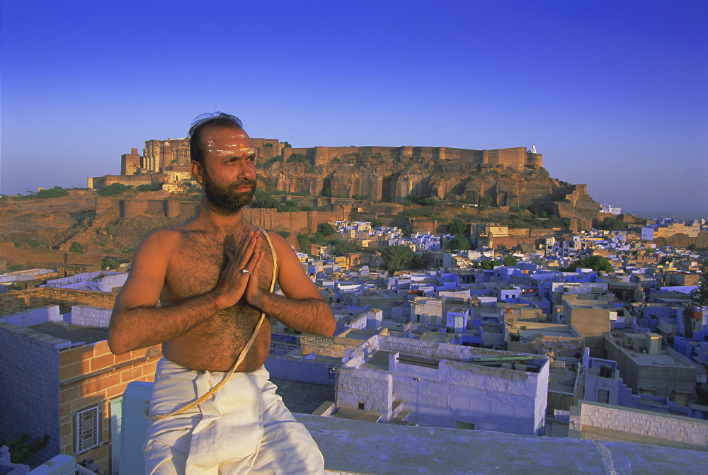 A holy man and the 'Blue city' and fort, Jodhpur, Rajasthan State, India, Asia