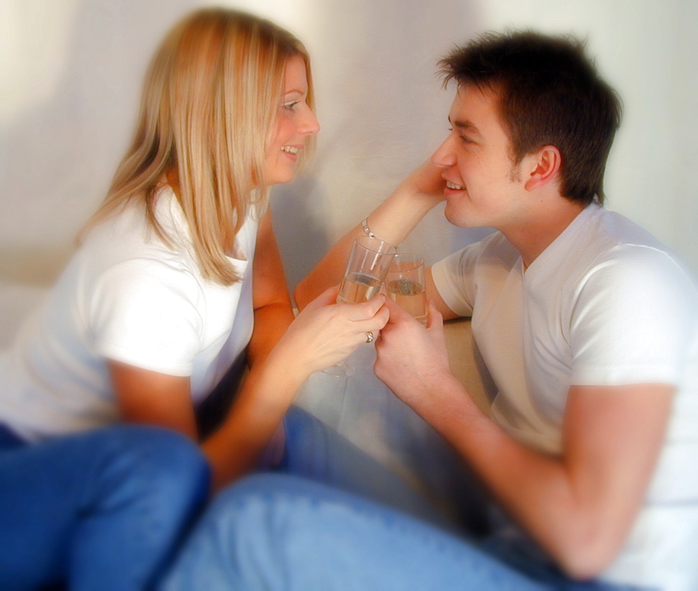 Couple talking to each other while having a drink