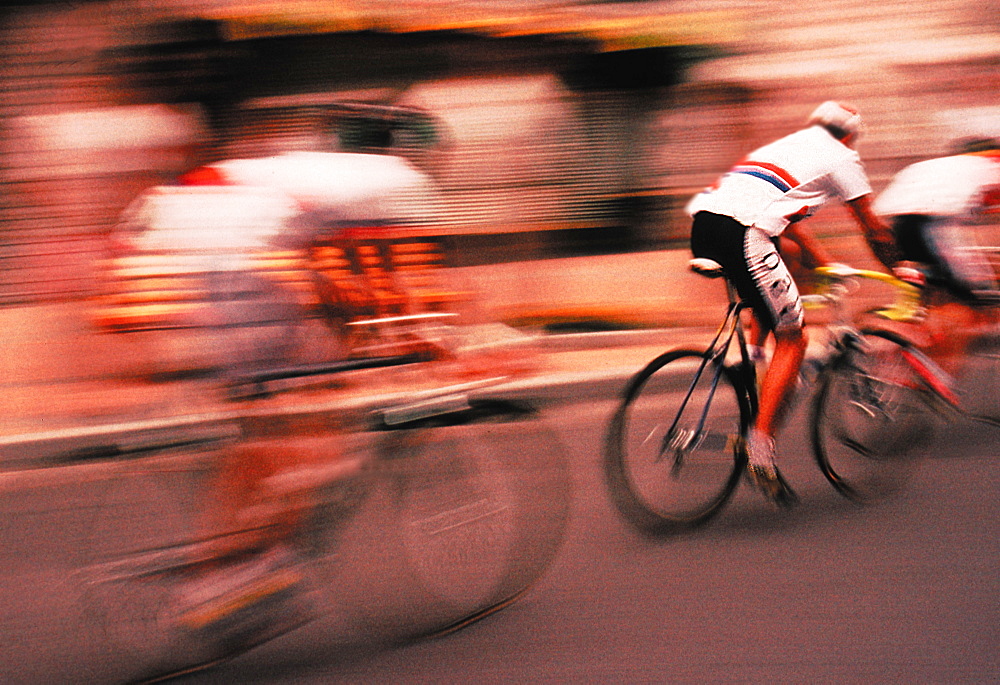 Competitors in a cycle race travelling at speed