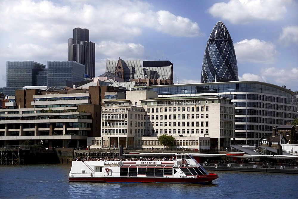 View across the River Thames to the City of London, with the Gherkin (Swiss Re Building) and Natwest Tower on skyline, London, England, United Kingdom, Europe