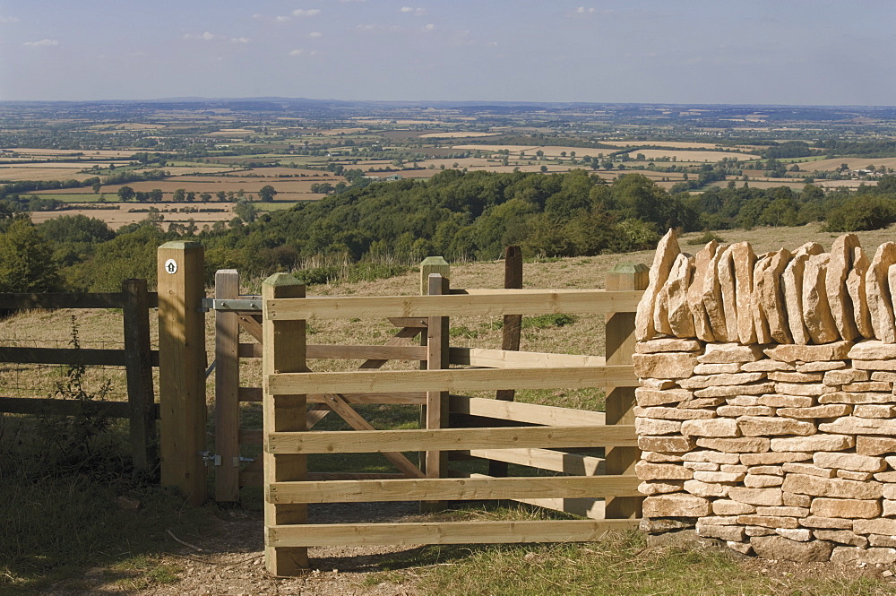 Refurbished gate and dry stone wall on the Cotswold Way footpath, Dover Hill near Chipping Campden, The Cotswolds, Gloucestershire, England, United Kingdom, Europe