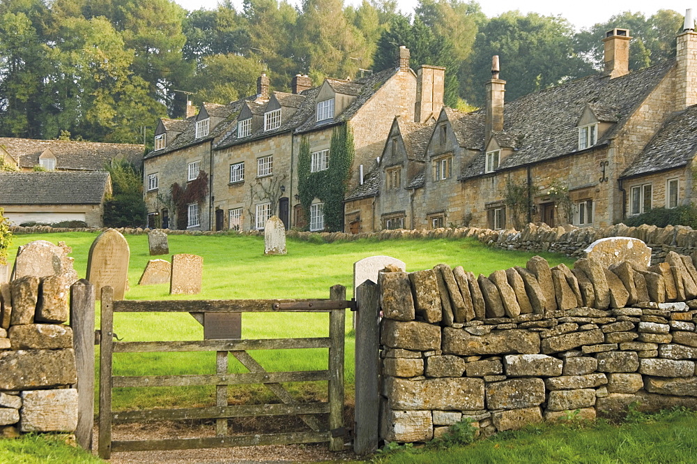 Dry stone wall, gate and stone cottages, Snowshill village, The Cotswolds, Gloucestershire, England, United Kingdom, Europe