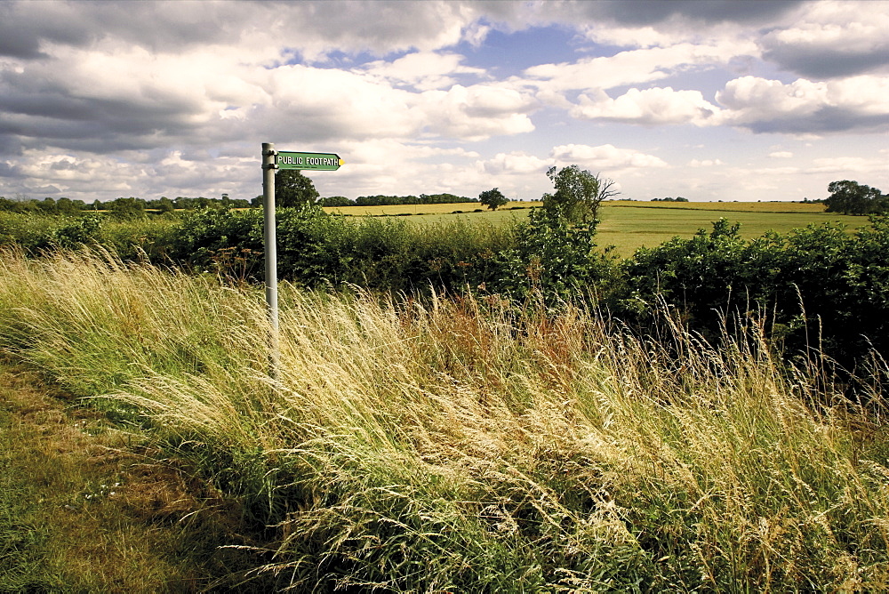 Public footpath sign, motte and bailey castle, Yelden (Yielden) village, Bedfordshire, England, United Kingdom, Europe