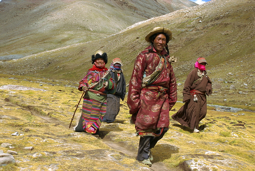 Tibetan Buddhist pilgrims on the kora, walking around Mount Kailas (Mount Kailash), which is sacred to Buddhists and Hindus, Tibet, China, Asia