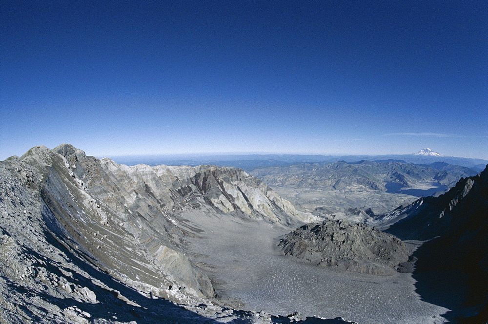 Lava dome in crater seen from rim, Mount St. Helens after 1980 eruption, with Spirit Lake and Mount Rainier in the distance, Mount St. Helens National Volcanic Monument, Washington State, United States of America (U.S.A.), North America