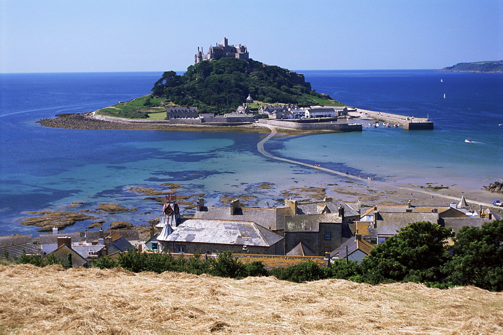 Submerged causeway at high tide, seen over rooftops of Marazion, St. Michael's Mount, Cornwall, England, United Kingdom, Europe