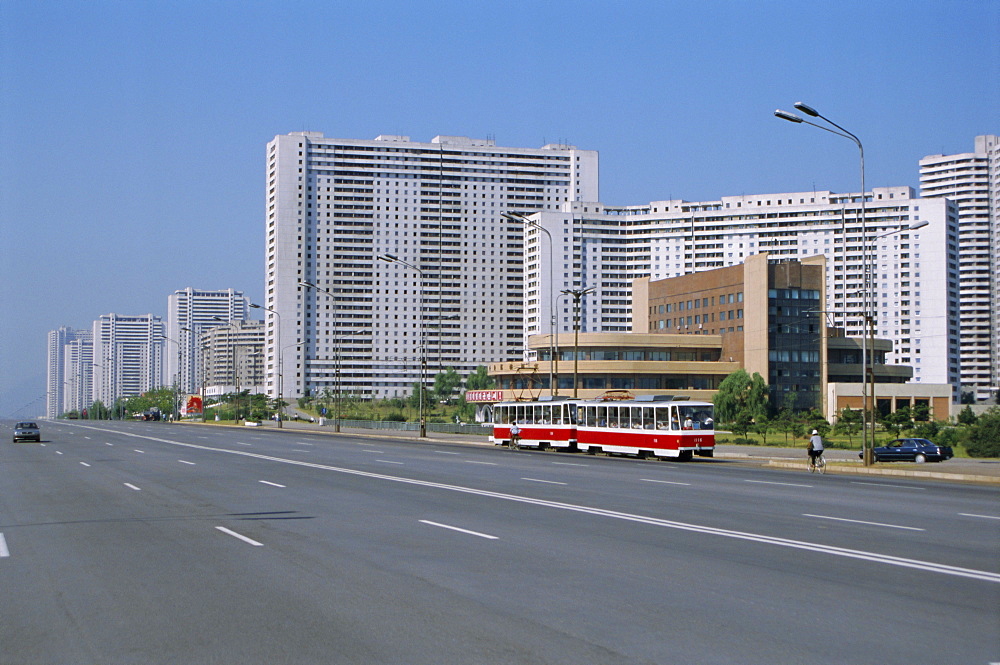 Blocks of flats beside road to Nampo, ten lanes wide but no traffic, Pyongyang, North Korea, Asia