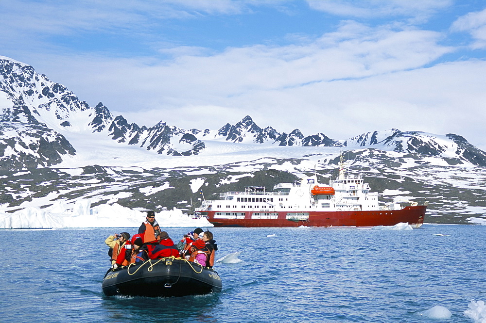 Tourists in zodiac from ice-breaker tour ship, Krossfjorden icebergs and glacier, Spitsbergen, Svalbard, Norway, Scandinavia, Europe