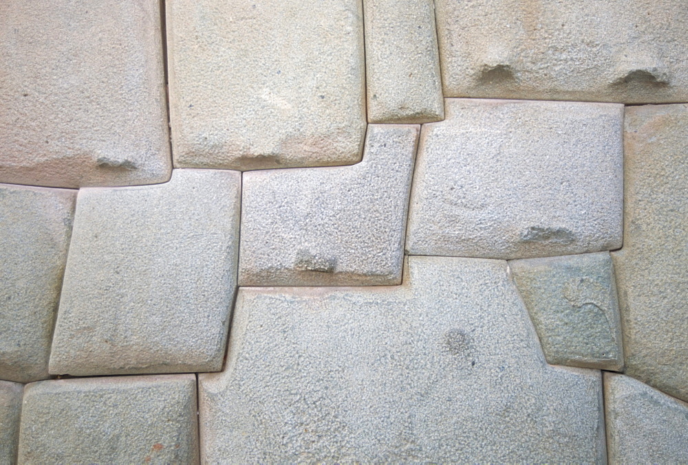 Interlocking Inca stonework in granite, in old town, now the Museo Arte Religioso, Cuzco, Peru, South America