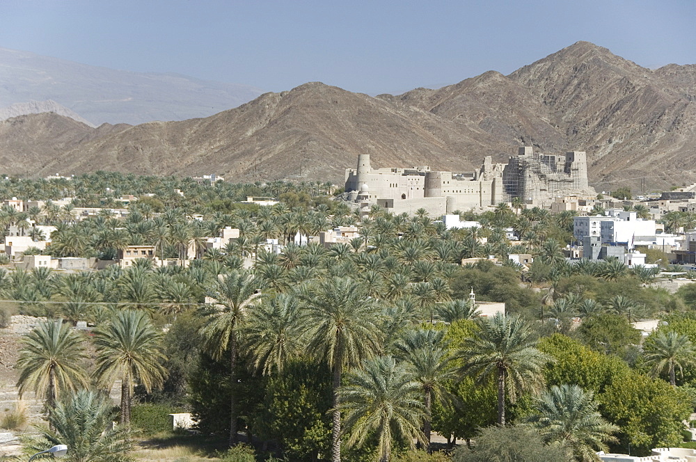 Fort in palmery on edge of modern oasis town, Bahla, Oman, Middle East