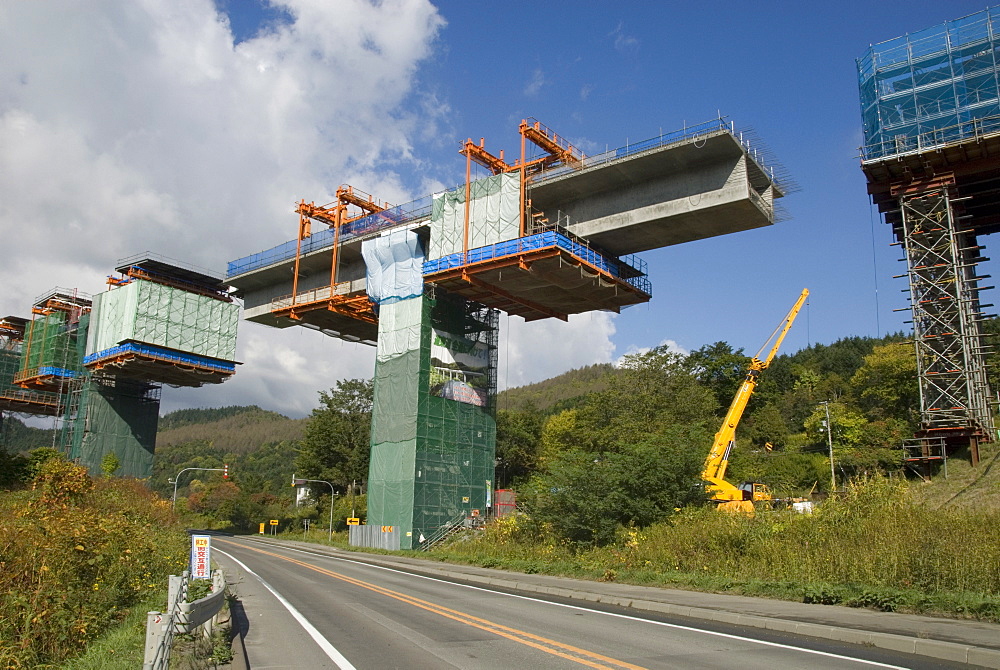 Construction of new viaduct near Hidaka, for freeway from Sapporo to Obihiro, across central Hokkaido, Japan, Asia