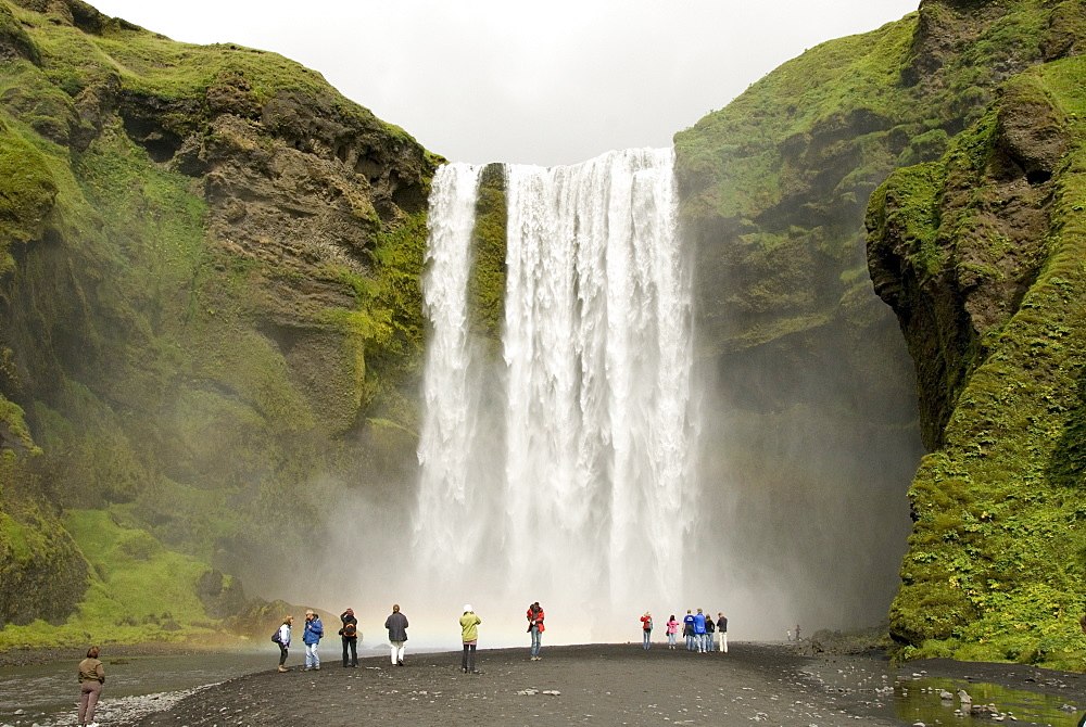 Skogarfoss, the powerful curtain waterfall drops 60 m over a cliff of basalt lavas, south coast, Iceland, Polar Regions