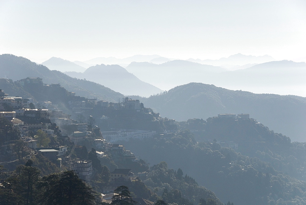 View south from Mussoorie over morning mist on foothills of Garwhal Himalaya, Uttarakhand, India, Asia