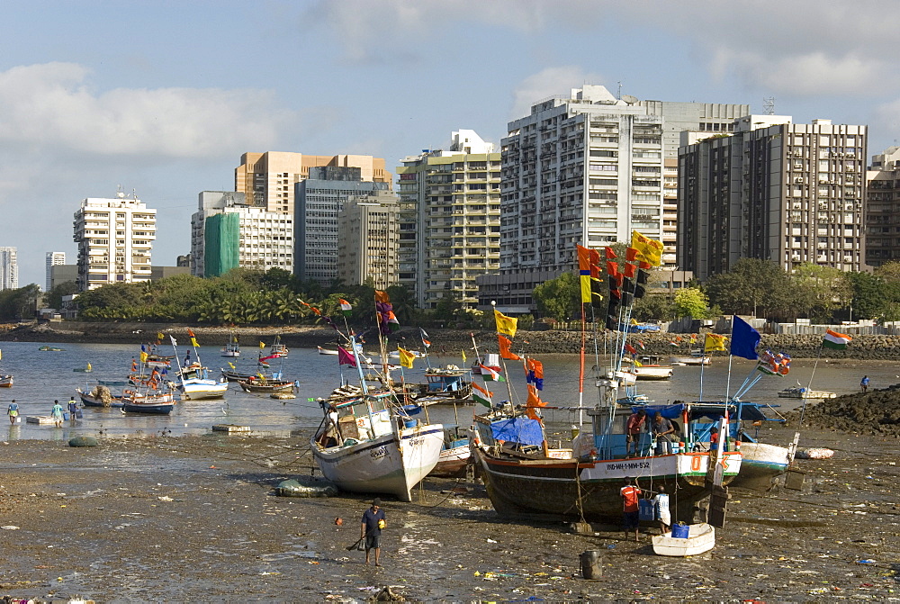 The beach in front of Colaba fishing village, with high-rises of Nariman Point across the bay, Mumbai, India, Asia 