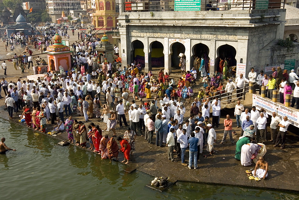 Worshippers at the Ramkund tank on the ghats along the holy River Godavari, Nasik (Nashik), Maharashtra, India, Asia 