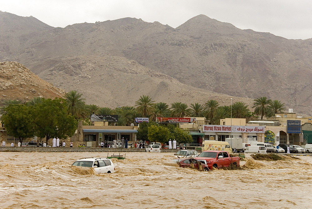 A flash flood in the wadi through the centre of town, Nizwa, Oman, Middle East 