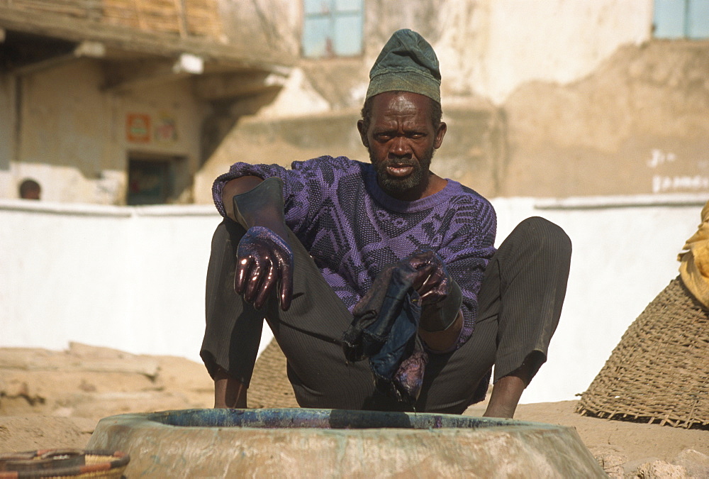 Man working at Kofar Mata dyeing pits, Kano, Nigeria, West Africa, Africa