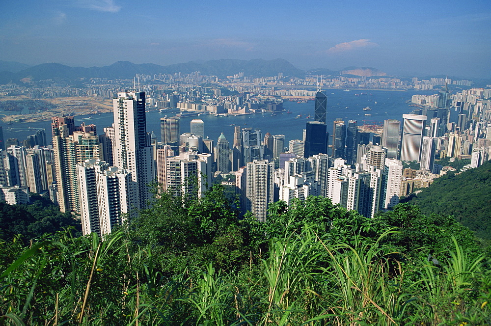 View from Victoria Peak over the city skyline of Hong Kong Island to Kowloon in the distance, Hong Kong, China, Asia