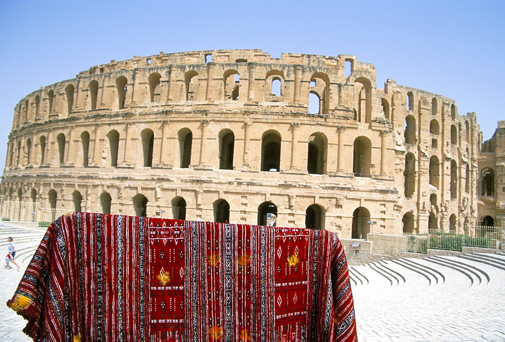 Rug hanging in front of the Collosseum, El Jem (El Djem), UNESCO World Heritage Site, Tunisia, North Africa, Africa