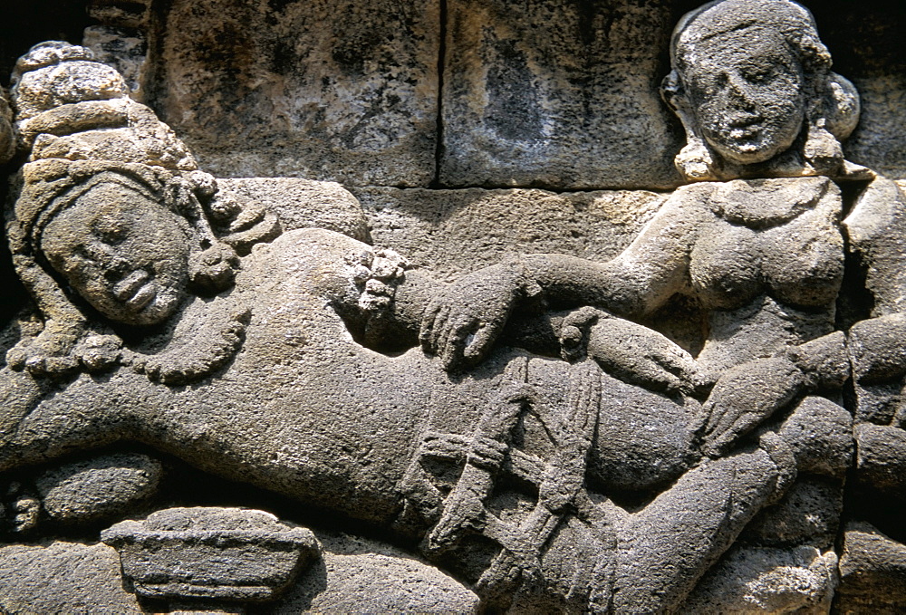 Ancient stone carved panel, Borobudur Temple, UNESCO World Heritage Site, island of Java, Indonesia, Southeast Asia, Asia